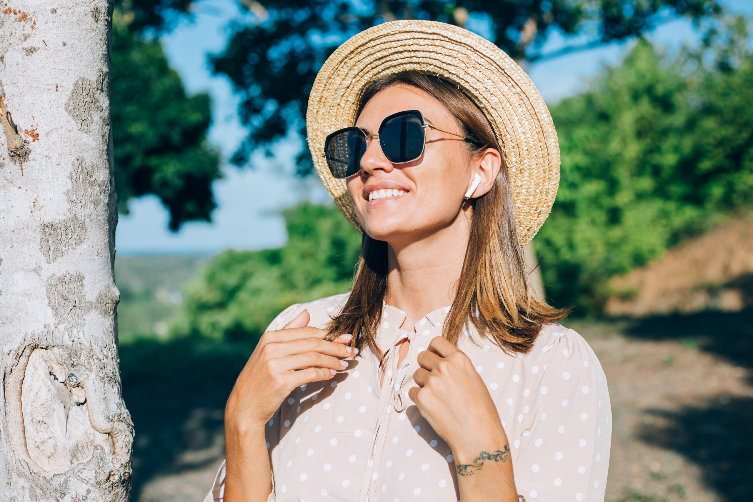 a woman wearing sunglasses with adequate UV protection